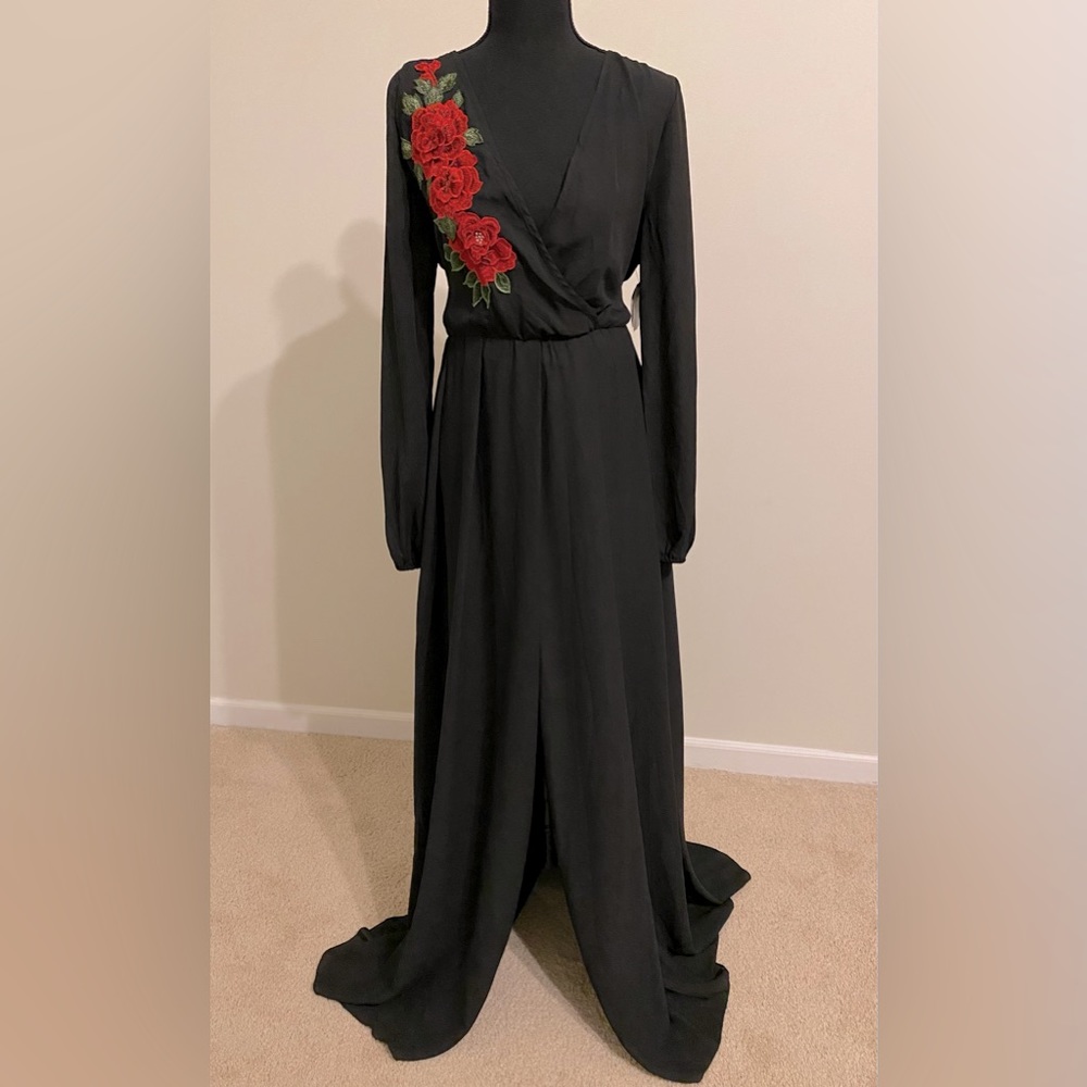 Long black dress. Ready for the holidays. Tags on. Rose detailed. Stretchy.
